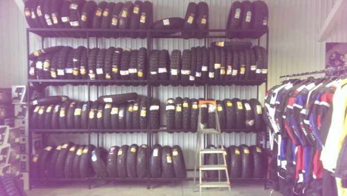 There are so many tyres, they need a ladder to get at them all. A ladder.